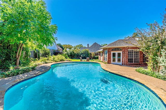 view of pool with french doors