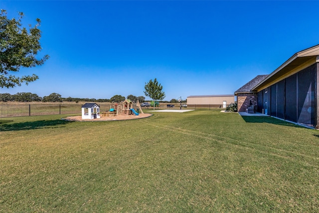 view of yard with a playground