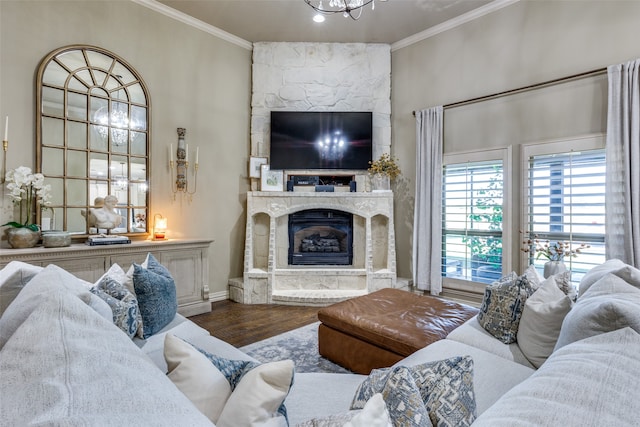 living room with ornamental molding, a fireplace, and hardwood / wood-style floors