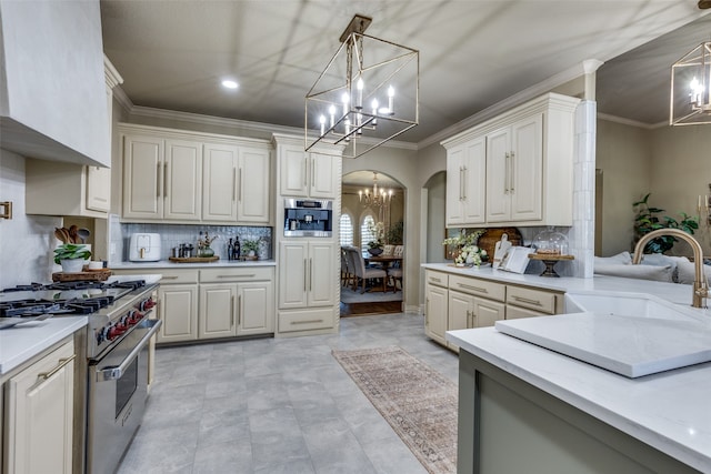 kitchen with pendant lighting, sink, stainless steel appliances, exhaust hood, and crown molding