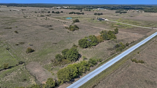 birds eye view of property featuring a rural view