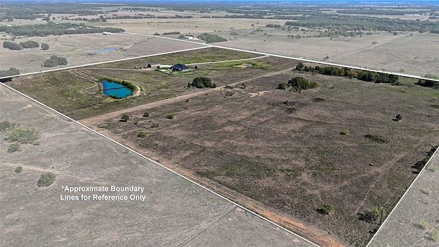 birds eye view of property featuring a rural view