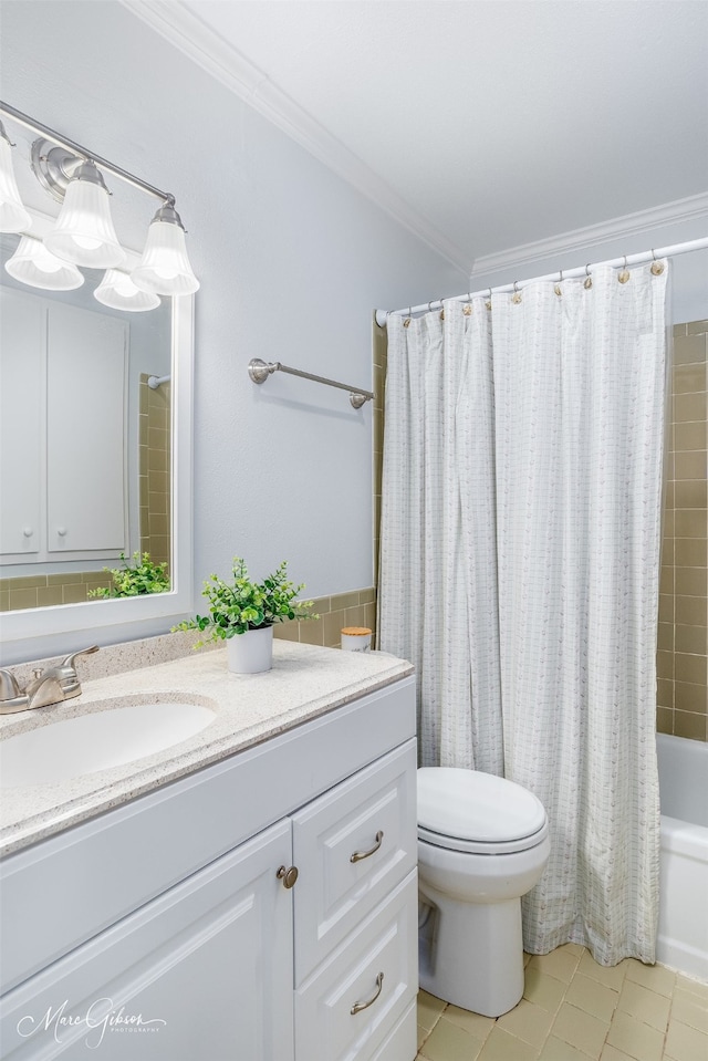 full bathroom with vanity, crown molding, and toilet