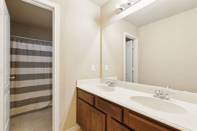 bathroom featuring tile patterned floors and vanity