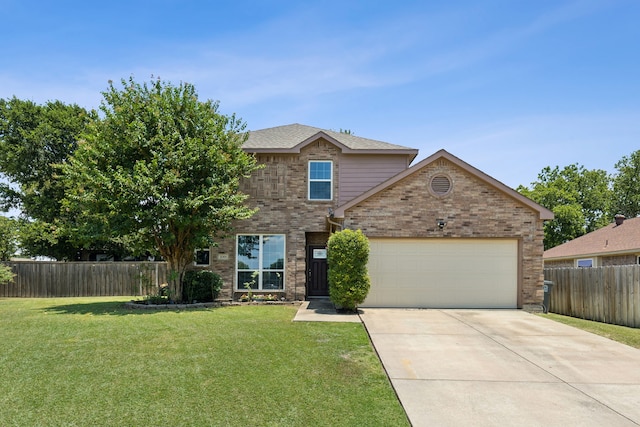 view of property with a garage and a front yard