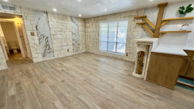 unfurnished living room with light hardwood / wood-style floors