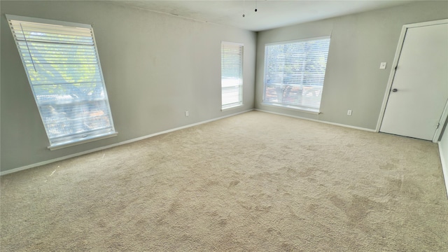 empty room featuring light carpet