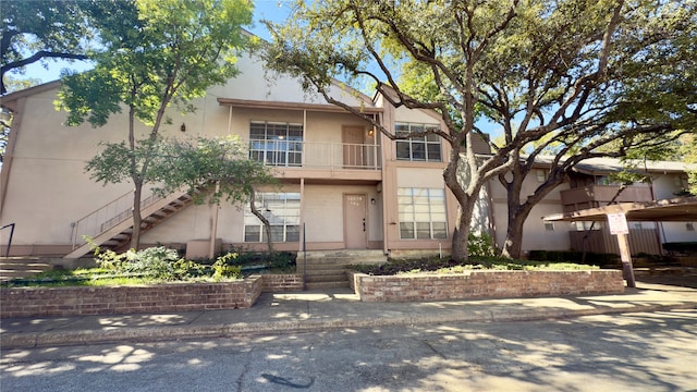 view of front of home with a balcony