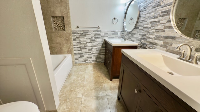 full bathroom featuring vanity, tile patterned flooring, plus walk in shower, tile walls, and toilet