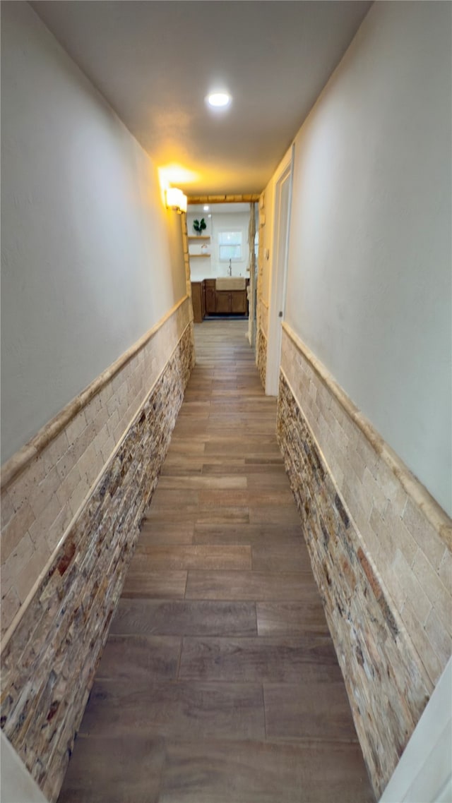 hall with hardwood / wood-style flooring