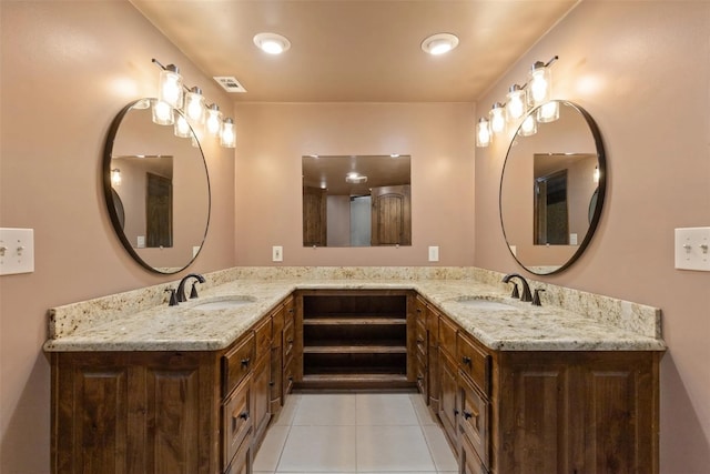 bathroom with tile patterned flooring and vanity