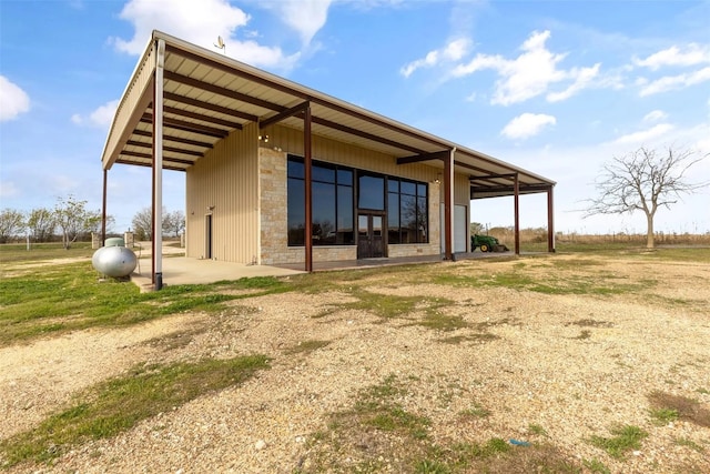 back of property with an outbuilding