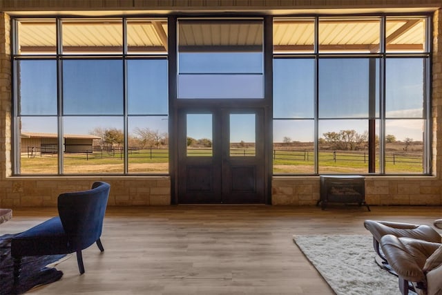 sunroom / solarium featuring a rural view