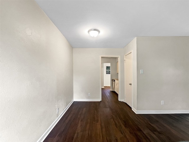 hallway featuring dark wood-type flooring