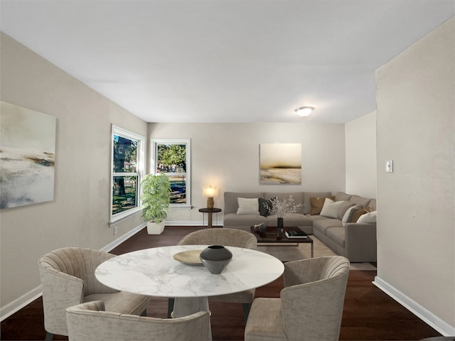 dining room with dark hardwood / wood-style flooring