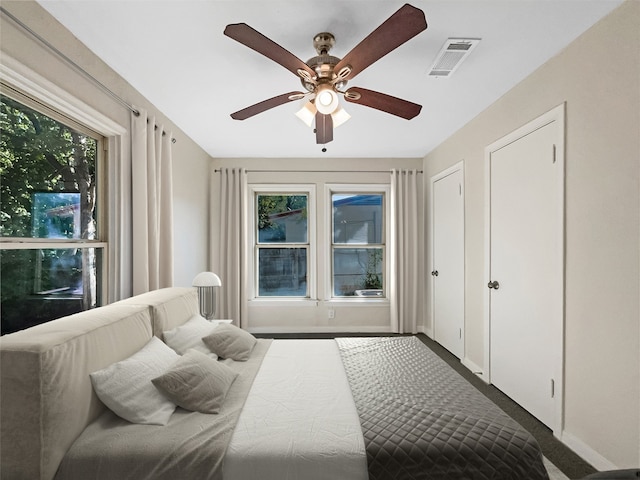 carpeted bedroom featuring ceiling fan