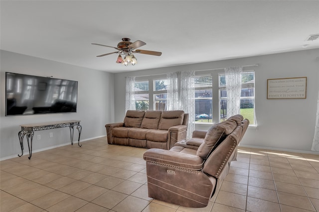 6001 Red Drum Dr, Fort Worth, TX 76179 - living area featuring light tile patterned floors, ceiling fan, plenty of natural light, and baseboards