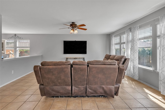 living room with light tile patterned flooring and ceiling fan