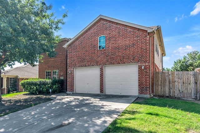 view of home's exterior featuring a garage and a lawn