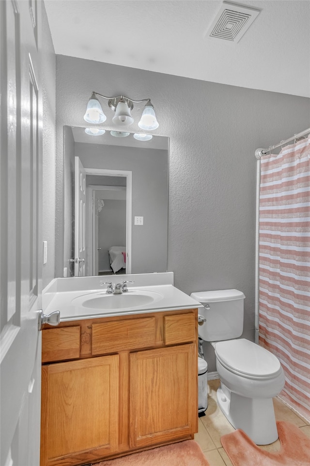 6001 Red Drum Dr, Fort Worth, TX 76179 - full bathroom with tile patterned flooring, vanity, toilet, a textured wall, and a shower with shower curtain