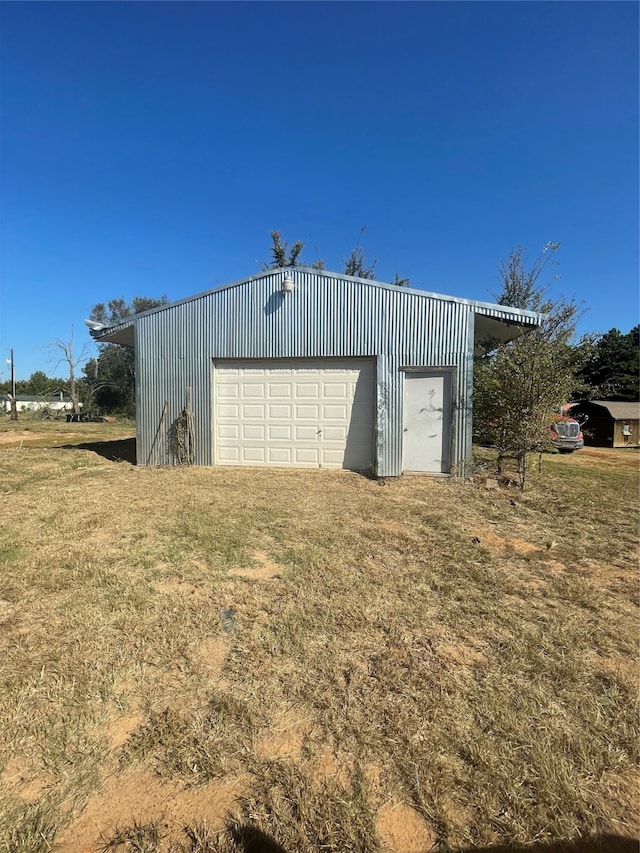 garage with a lawn