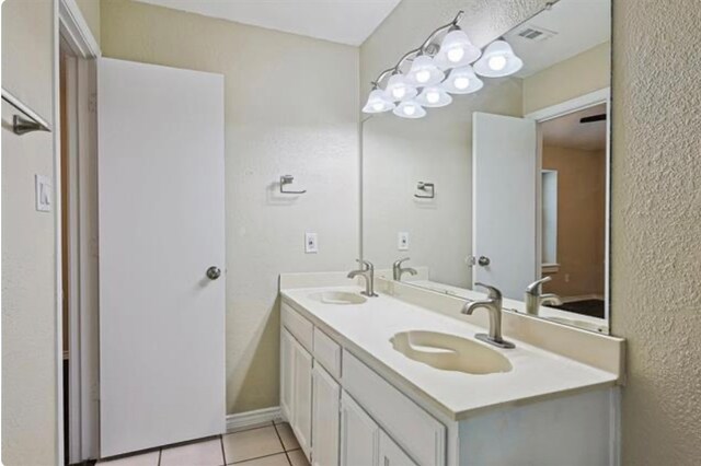 bathroom with vanity and tile patterned floors