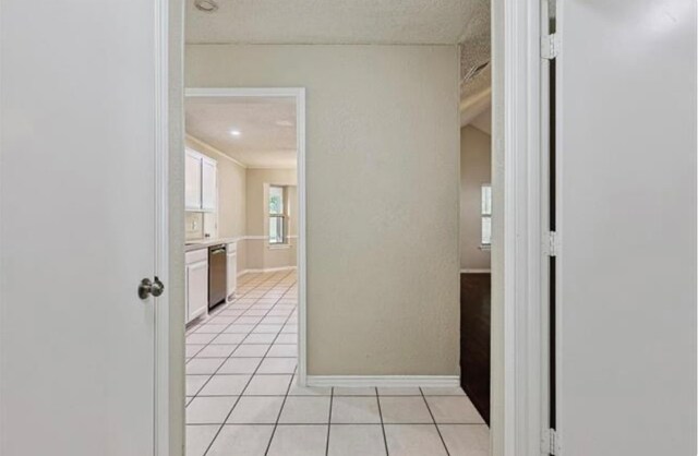 hall with light tile patterned flooring