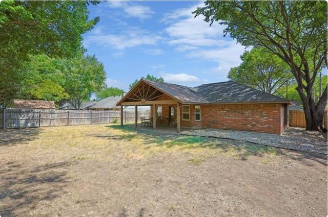 rear view of house featuring a patio