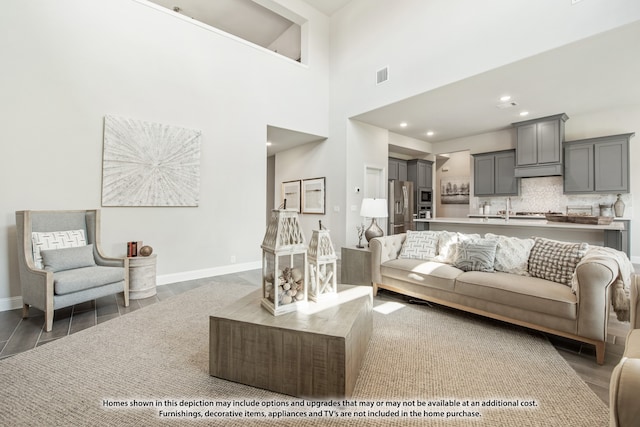 living room with a towering ceiling