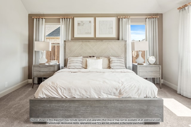 bedroom featuring carpet flooring and lofted ceiling