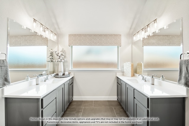 bathroom with tile patterned flooring, lofted ceiling, and vanity