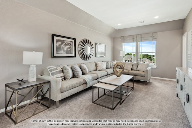 carpeted living room with vaulted ceiling