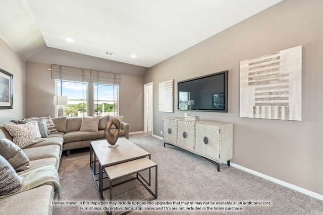 living room featuring lofted ceiling and carpet flooring