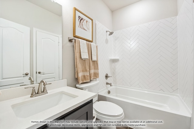 full bathroom with vanity, tiled shower / bath, and toilet