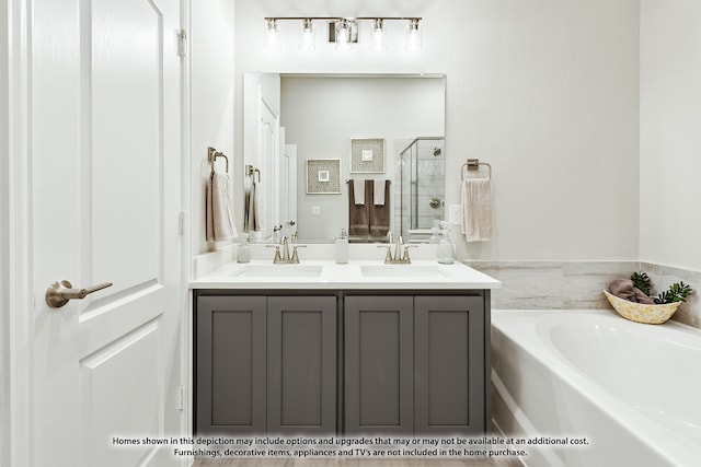 bathroom featuring independent shower and bath and vanity