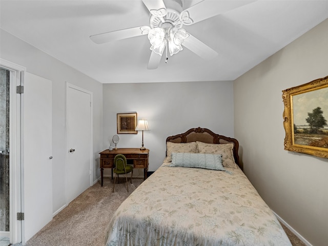 bedroom featuring ceiling fan and carpet