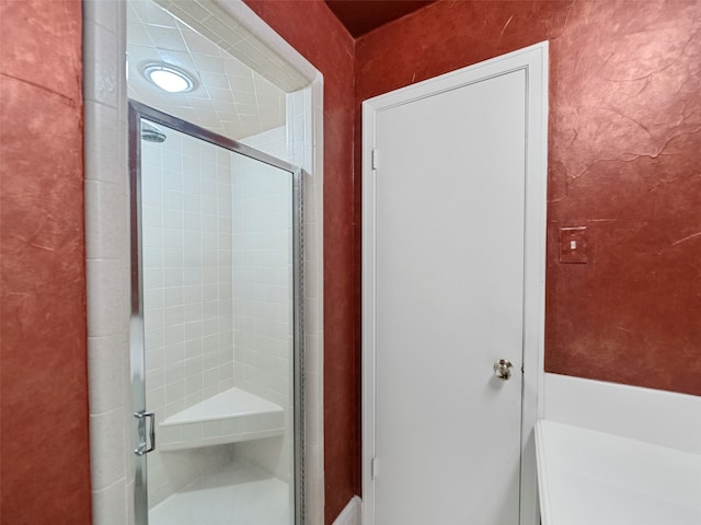 bathroom with an enclosed shower