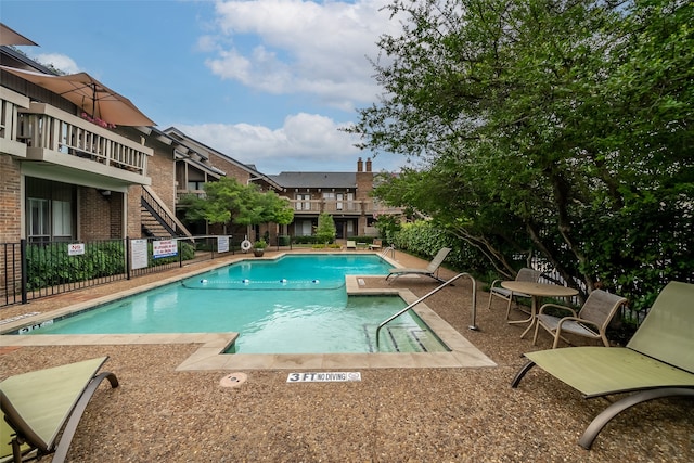 view of swimming pool featuring a patio