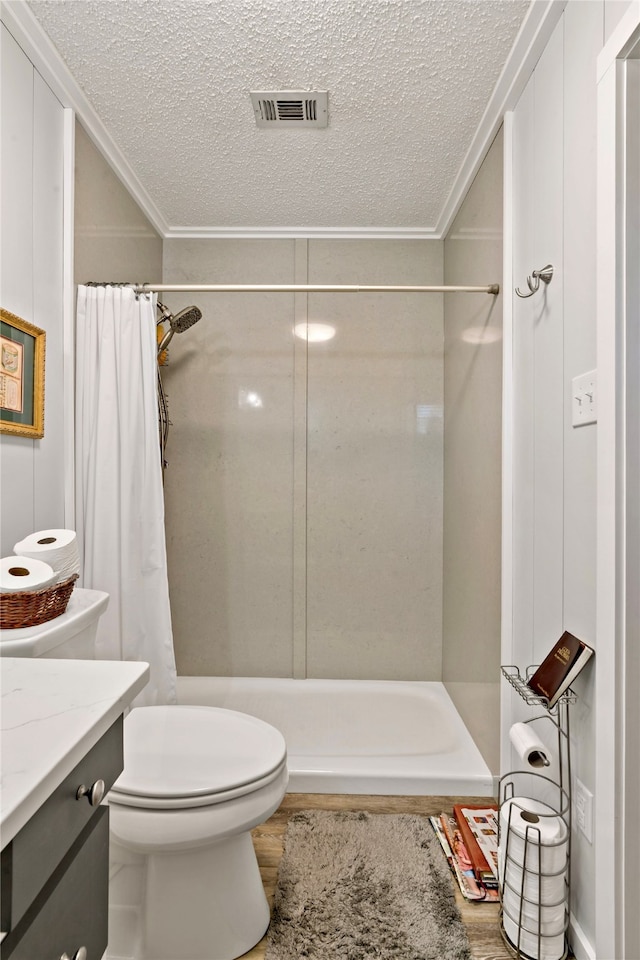 bathroom featuring wood-type flooring, a shower with curtain, and toilet