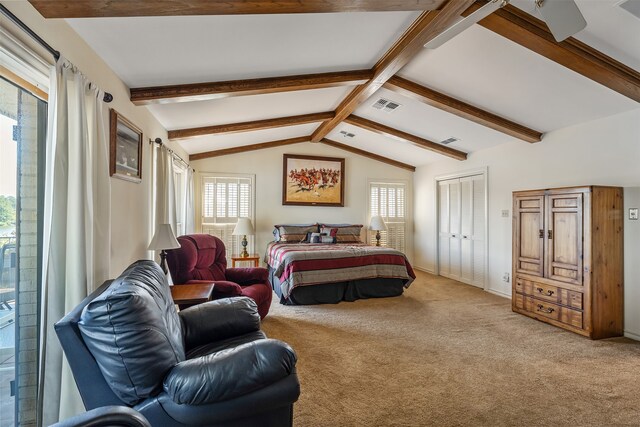 carpeted bedroom with vaulted ceiling with beams and multiple windows