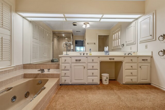 bathroom with a relaxing tiled tub and vanity