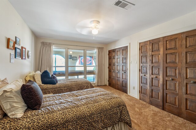 bedroom with ceiling fan and carpet