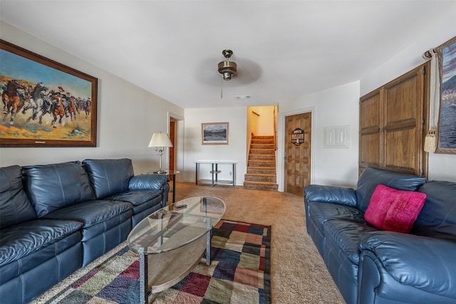 living room featuring carpet floors and ceiling fan