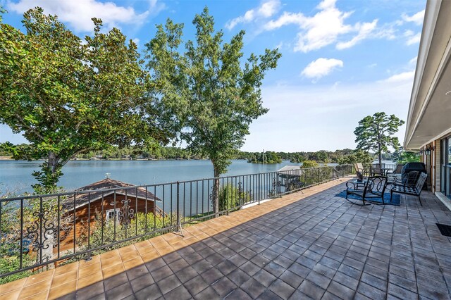 view of patio / terrace with a water view