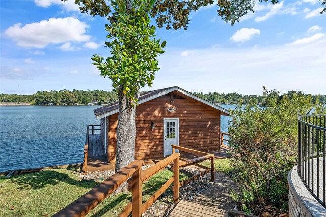 exterior space with a boat dock and a water view