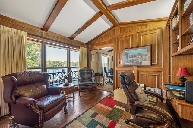 office area with vaulted ceiling with beams, wood walls, and dark hardwood / wood-style flooring