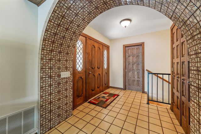 foyer with light tile patterned floors