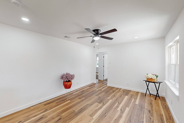 unfurnished room featuring ceiling fan and light hardwood / wood-style flooring