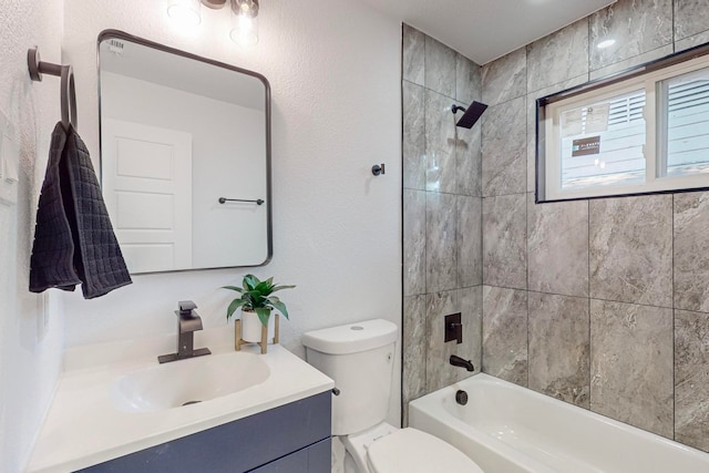 full bathroom featuring toilet, vanity, and tiled shower / bath combo