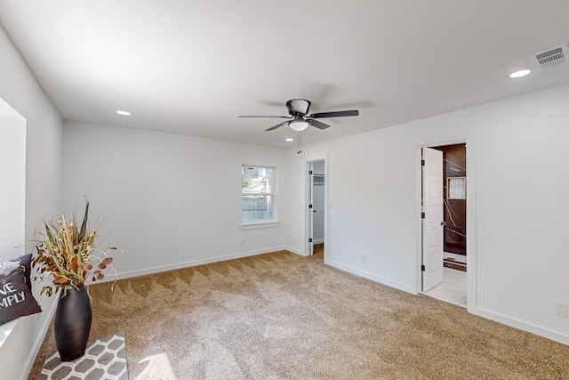 carpeted empty room with ceiling fan